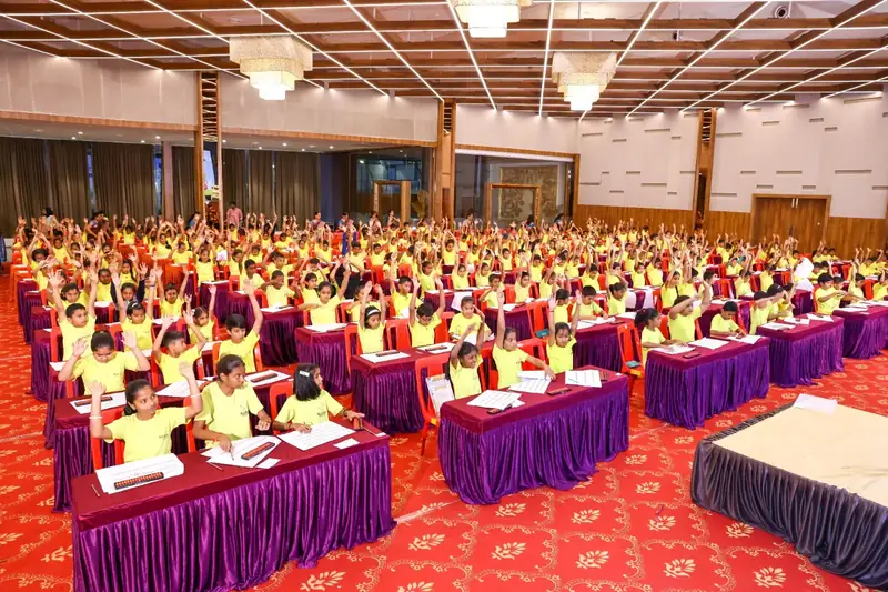 Rows of children concentrating during a timed abacus competition round