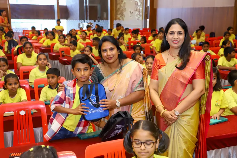 A student being congratulated by mentors in the audience